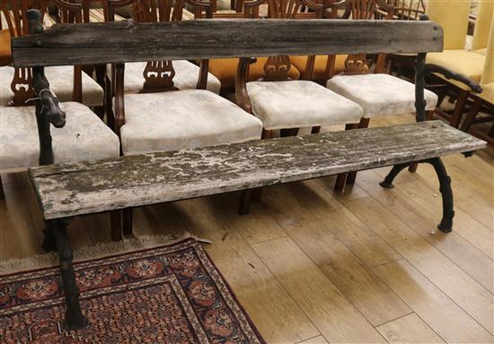 An iron and oak garden bench W.182cm